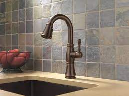 Classical design with multiple handle and spout options as well as a full complement of accessories and finishes, including polished nickel makes the cassidy collection the obvious choice for a timeless, traditionally styled bath. Delta Cassidy One Handle Pull Down Venetian Bronze Bar Prep Kitchen Faucet At Menards
