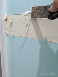 Slide the thin edge of the pry bar into the gap, using the putty knife as a shield to protect the wall. How To Remove A Chair Rail And Repair The Walls For Paint