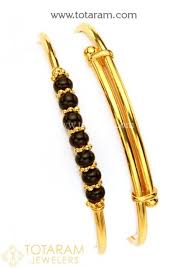 Black And Gold Bracelet For Babies 22k Baby Bangles In 2020 Gold Baby Bangles Gold Bangles For Women Baby Bangles