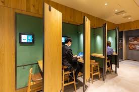private phone booths and coffee aplenty this new starbucks looks an awful lot like wework coworking space coworking shared office
