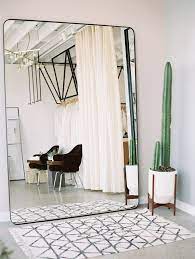 A mirror in a beautiful frame will accentuate any interior and can make your bedroom look bigger. Loho Bride West Hollywood Store Wedding Party Ideas Home Decor Minimalist Bedroom House Interior