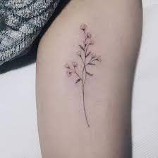 Lately there has been a movement that focuses on minimalist and smaller tattoo designs, instead of the ones that look complex and take weeks to. This In The Shape Of An Infinity Sign Baby Breath Tattoo Dainty Tattoos Beautiful Flower Tattoos