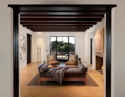 Dark walls add a theatrical backdrop to beautiful design elements and works of art. Beautiful House Design Featuring Dark Wood And Stone Architectural Elements