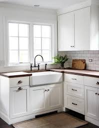 White Shaker Kitchen Cabinets With Wood Countertops And Farmhouse Sink Cottage Kitc White Shaker Kitchen Cabinets White Kitchen Design White Shaker Kitchen