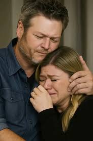 Just hours after the heartbreaking passing of her ex-husband Brandon  Blackstock, Kelly Clarkson sat quietly in the crowd—her heart heavy,  fragile, and unprepared for what was to come. Then Blake Shelton took