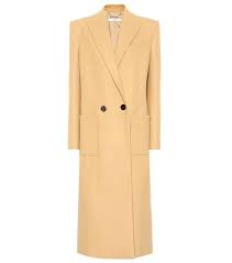 Darted waist, notched lapel, long sleeves, drop shoulder, side seam pockets. Camel Virgin Wool Blend Double Breasted Coat Editorialist