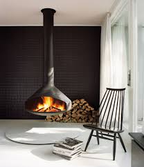 Dezeen Promotion Fireplace Company Focus Whose Products Have Featured In Snohetta S Norwegian W In 2020 Living Room Scandinavian Floating Fireplace Hanging Fireplace