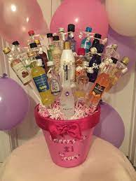 Surprise them on their day by sending a birthday gift filled with gourmet treats! Booze Bouquet For A 21st Birthday 21st Birthday Basket Alcohol Gift Baskets Alcohol Gifts