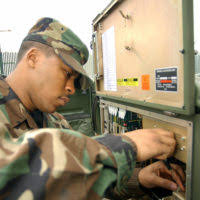 US Air Force (USAF) SENIOR AIRMAN (SRA) Sidney Crawford, Satellite  Communications Technician, 48th Communications Squadron (CS), Royal Air  Force (RAF) Lakenheath, England (ENG), replaces a Protocol Data Unit (PDU)  back-up battery for