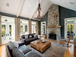 Rustic Living Room With Hardwood Floors Chandelier Stone Fireplace Exposed Farm House Living Room Cathedral Ceiling Living Room Vaulted Ceiling Living Room
