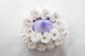 Diy purple and white diaper cake. How To Make A Diaper Cake In 3 Super Simple Steps Play Party Plan
