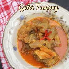 500 gr kikil kaki sapi, 2 batang sere geprak, 3 daun salam, 5 daun jeruk, 1 helai daun kunyit, 1 ruas lengkuas geprak, 2 biji asam kandis, 1.5 liter santan kental dari 1 butir kelapa, minyak untuk menumis, bumbu halus, 7 siung bawang merah, 4 siung bawang putih, 2 butir kapulaga. Gulai Tunjang Ala Rumah Makan Padang Dapur Ngebut