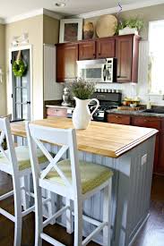 Perfect for small spaces, this portable kitchen island easily rolls out when you need it and neatly tucks away when you don't. Diy Tricks To Customize A Kitchen Island From Thrifty Decor Chick