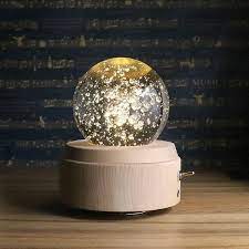 Christmas corner decoration with golden deer gift box tree branch and snowflake transparent background. Crystal Ball Music Box Apollobox