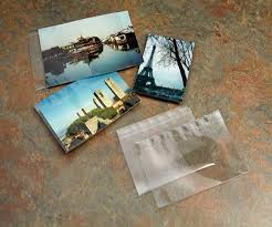Remove the adhesive backings and place inside your scrapbook album! 4x6 Photo Sleeves Clear Fold Lock