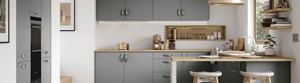 The crisp, clean white stone worktops help to create some contrast and separation, while the wooden island worktop brings in a little texture and ties everything together with the wooden floor. Contemporary Kitchens Liverpool Cleveland Kitchens