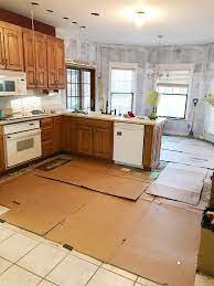 If you do tile in under the cabinets, there is no water seal at the cabinet base as there would be if there was base or shoe put there, which would stop water from going under the cabinets. How To Remove Tile Floors Tile Removal Diy Kitchen Remodel Flooring