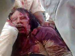 Muammar gaddafi died from wounds he suffered in an attack by rebels after he had already been captured and not in a firefight, according to a major report today on the libyan dictator's last hours. New Gaddafi Video Footage Purportedly Shows Late Libyan Leader After His Death Colombo Telegraph