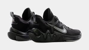 The shoe features various shades of blues used throughout its entire shoe with black appearing on the heel, liner, insole, and portion of the rubber outsole. Giannis Immortality Grade School Basketball Shoe Black Gray Shoe Palace