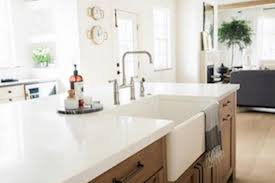 As long as the tone is neutral, most. White Countertops With An Inset Farmhouse Sink Sit Atop Wood Cabinets Hgtv