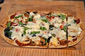 How To Make Delicious Pizza Using Flatout Wraps Healthy Pizza Recipes Flatout Wraps Recipes Flatout Recipes