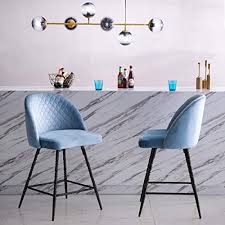 Commonly seen in bars and restaurants. Yongqiang 26 Inch Upholstered Swivel Stools Blue Velvet Bar Stools Set Of 2 Metal Counter Height Bar Chairs Buy Online In Antigua And Barbuda At Antigua Desertcart Com Productid 171227587