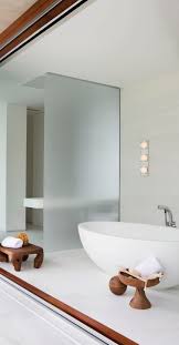 Product description 4 light vanity fixture from the hallsburg collectiondimensions: Modern White Bathroom With Frosted Glass And Bathtub Lit By Bathroom Wall Light Modern White Bathroom Bathroom Lighting Bathroom Wall Lights