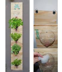 All you need are bottles cut in half, cactus plants or succulents, and many colorful threads to get a really cool decorative effect. How To Build A Vertical Garden From Soda Bottles How To