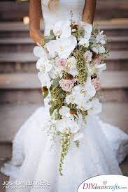 Bridal bouquet in blue, pink and peach. White Orchids And Pink Roses Bridal Bouquet Ideas Bridal Bouquet Flowers Orchid Bouquet Wedding Orchid Bridal Bouquets