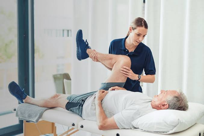 Physical therapist caring for patient