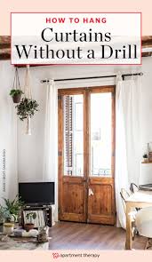 Love this mid century modern wood curtain rod and the curtain just mount from ceiling wood curtain rods mid century modern curtains wood curtain. How To Hang Curtains Without Drilling Into Walls Apartment Therapy