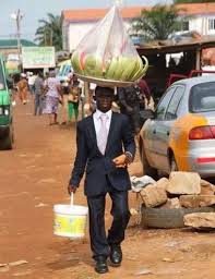 Meet The Ghanaian Man Who Wears Suit To Hawk Fruits