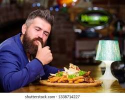 Image of people enjoying a delicious meal at a restaurant
