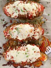 To the mashed potato you add all the other ingredients and then place that back into the potato, top with cheese and bake again. How To Make Baked Potatoes Topping Ideas Included Budget Bytes Recipe Stuffed Baked Potatoes Baked Potato Recipes Recipes