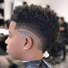 Long side swept hair with high fade 35 Popular Haircuts For Black Boys 2021 Trends Black Boys Haircuts Boys Fade Haircut Boys Haircuts Curly Hair
