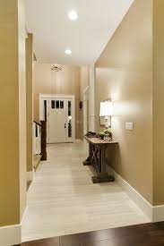 Light Tile With A Seamless Transition To Dark Wood Floor Perfect Love The Color On The Walls Living Room Wood Floor Dark Wood Floors Entryway Tile