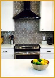 Grey Kitchen Backsplash 09 A Grey Hex Tile Kitchen Backsplash With White Grout Adds Color T Gray Kitchen Backsplash Grey Kitchen Tiles Kitchen Tiles Backsplash