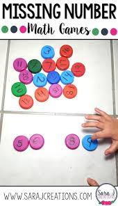 Missing Number Games Using Milk Bottle Caps For Practicing Numbers 1 20 And 1 30 Love This F Preschool Math Games Kindergarten Games Math Activities Preschool
