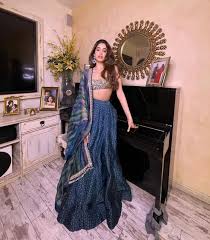 Born to sridevi and boney kapoor, she made her acting debut in 2018 with the romantic drama film dhadak. Janhvi Kapoor Looks Breathtaking In Blue Lehenga But Sridevi Boney Kapoor S Photo Frame Steals The Thunder