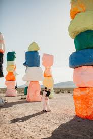 A stunning presentation against a natural canvas of beautiful, bright hues. True Romance Elopement Vegas Elopement At Seven Magic Mountains