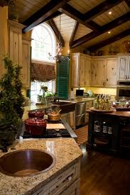 The white island really stands out among the dark cabinets and matching the dark wood ceiling. 52 Dark Kitchens With Dark Wood Or Black Kitchen Cabinets 2021 Home Stratosphere
