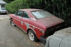 Image result for Herald Yellow 1976 Subaru