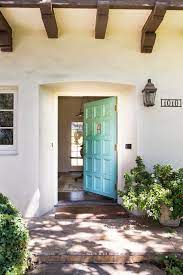 The stronghold front door is composed of solid wood that boast intricate design details and nostalgic overtones. Charmean Neithart Interiors Spanish Style Homes House Designs Exterior House Entrance Design