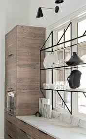 Modern Kitchen With Sleek Cabinets And Open Black Metal Shelving Organizedkitchen Modernkitchen Glass Shelves Kitchen Modern Luxury Interior Modern Kitchen