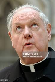 Edward Cardinal Egan looks skyward during a news conference outside... News  Photo
