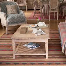This coffee table with shelves offers a useful resting place for remotes, magazines, snacks and so much more. Caned Coffee Table Susie Watson Designs Susie Watson Designs