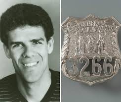 Recovered from Ground Zero, this NYPD shield belonged to John William  Perry. John was an officer with the 40th Precinct, a New York State Guard  first lieutenant, held a law degree and