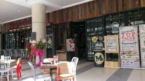 The concrete actually toned down the wood colour, making the whole place looks more energetic. Morganfield S Ioi City Mall Vmo