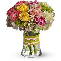 This stunning spring wedding bouquet features soft corals and a pop of bright pink to create a look that is whimsically feminine. What Wedding Flowers Are In Season In Spring Teleflora