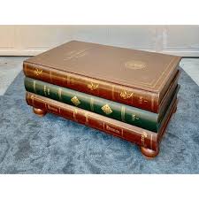 The table rises on ball feet. Leather Stacked Book Coffee Table In The Manor Of Maitland Smith Chairish